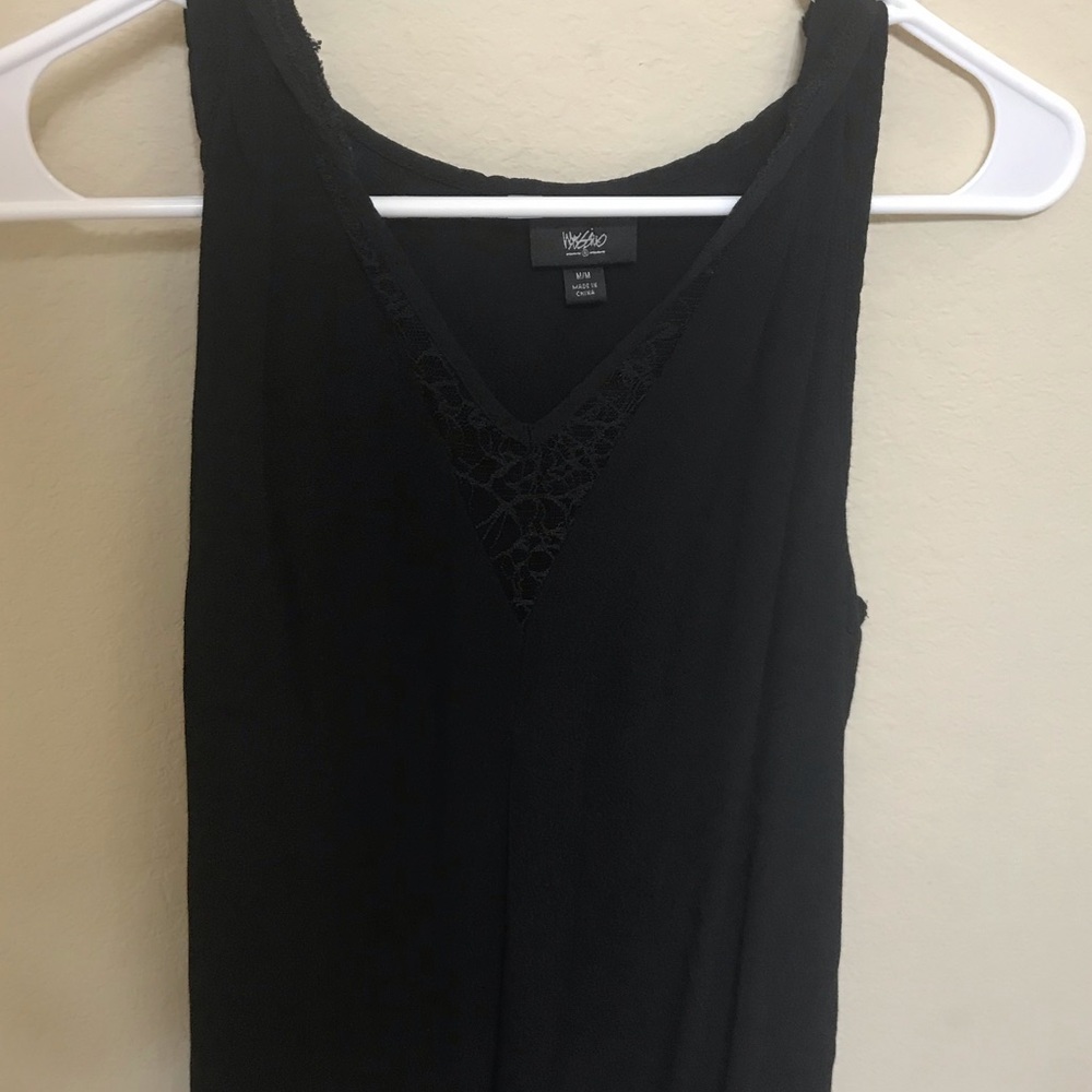 Black sleeveless blouse.